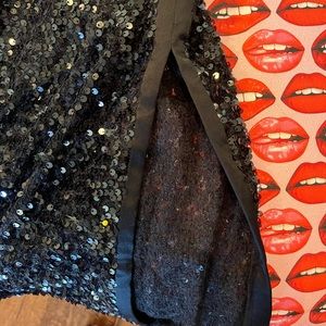 NWT Worth NY black sequins skirt. Side slit. Flat waist. Side zipper